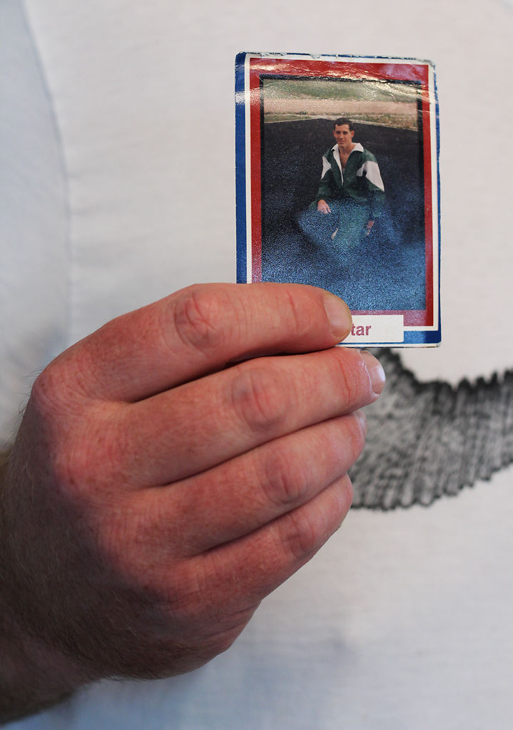 Chad Grotewiel holds up a picture of himself